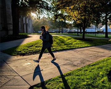 A student walks on campus.